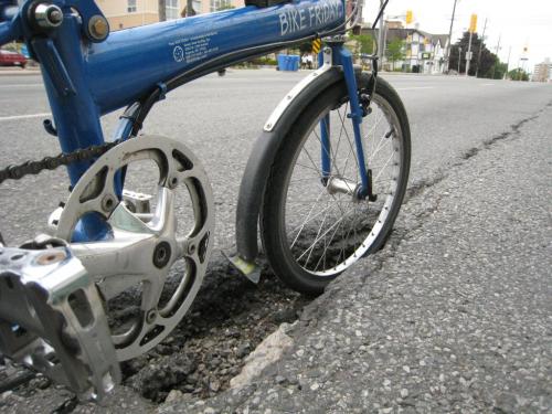 Massive bike-eating pothole on Dundas St. 